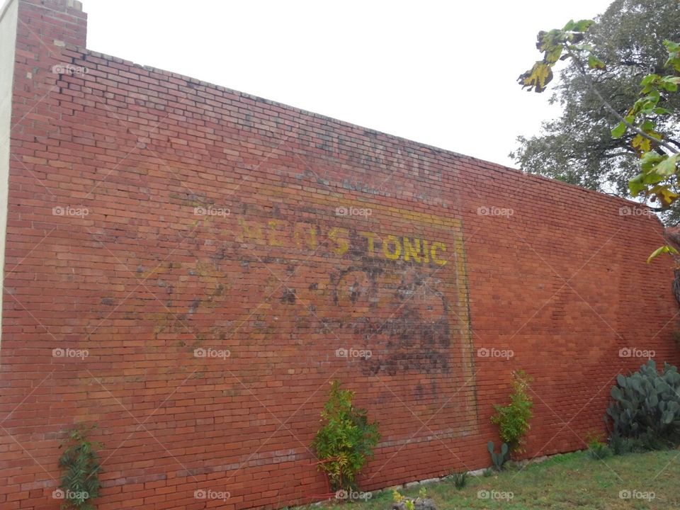 Advertisement painted on side of 1890 building