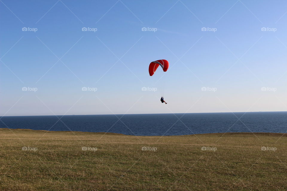 Paraglider by the coast at Kåseberga, Skåne Sweden.