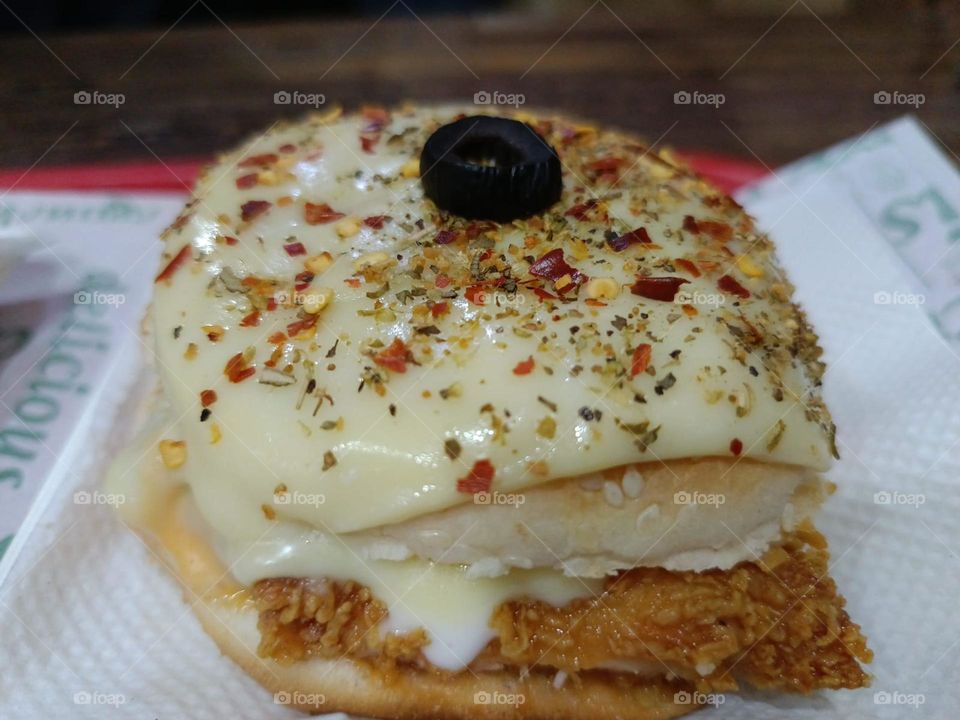 Looks like a tasty snack. That pastry looks scrumptious.