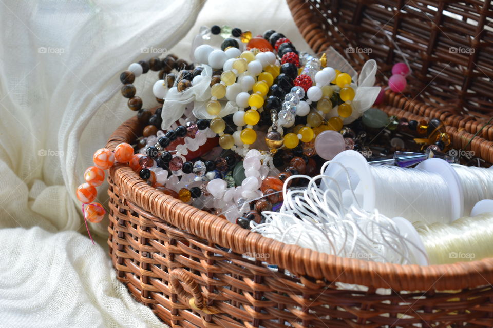 Beads necklace in wicker basket