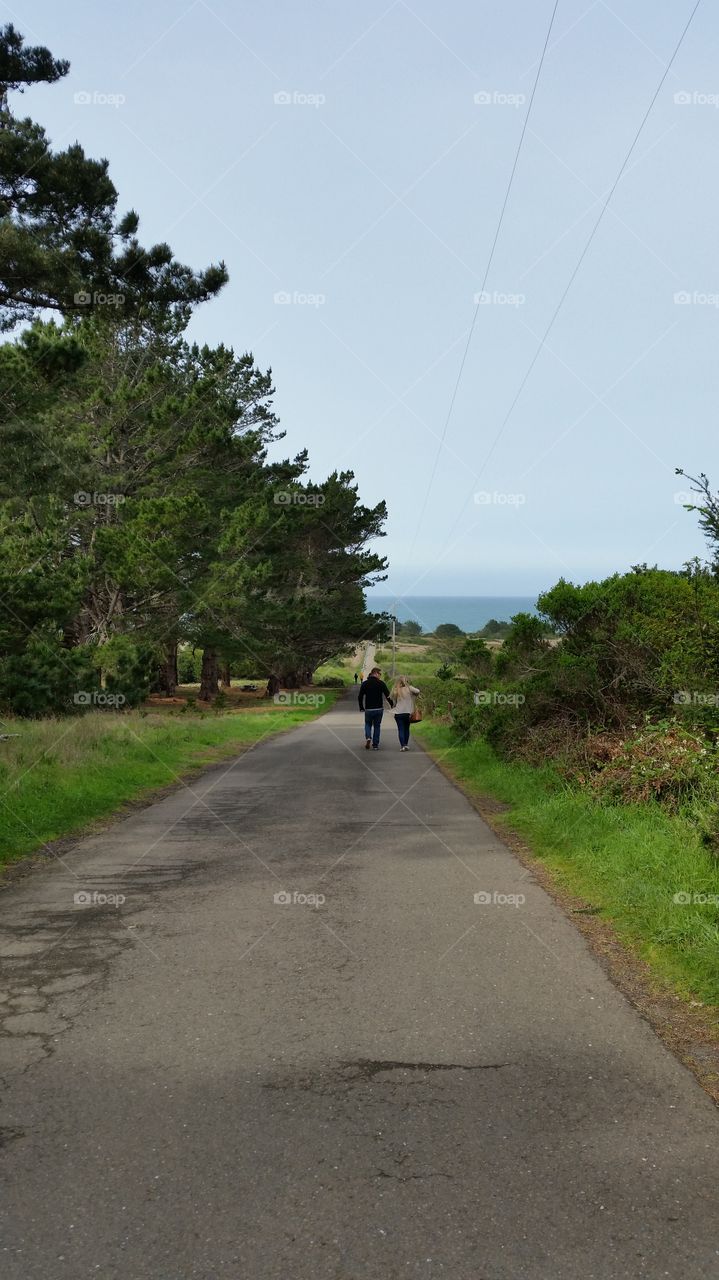 Couple holding hands while walking