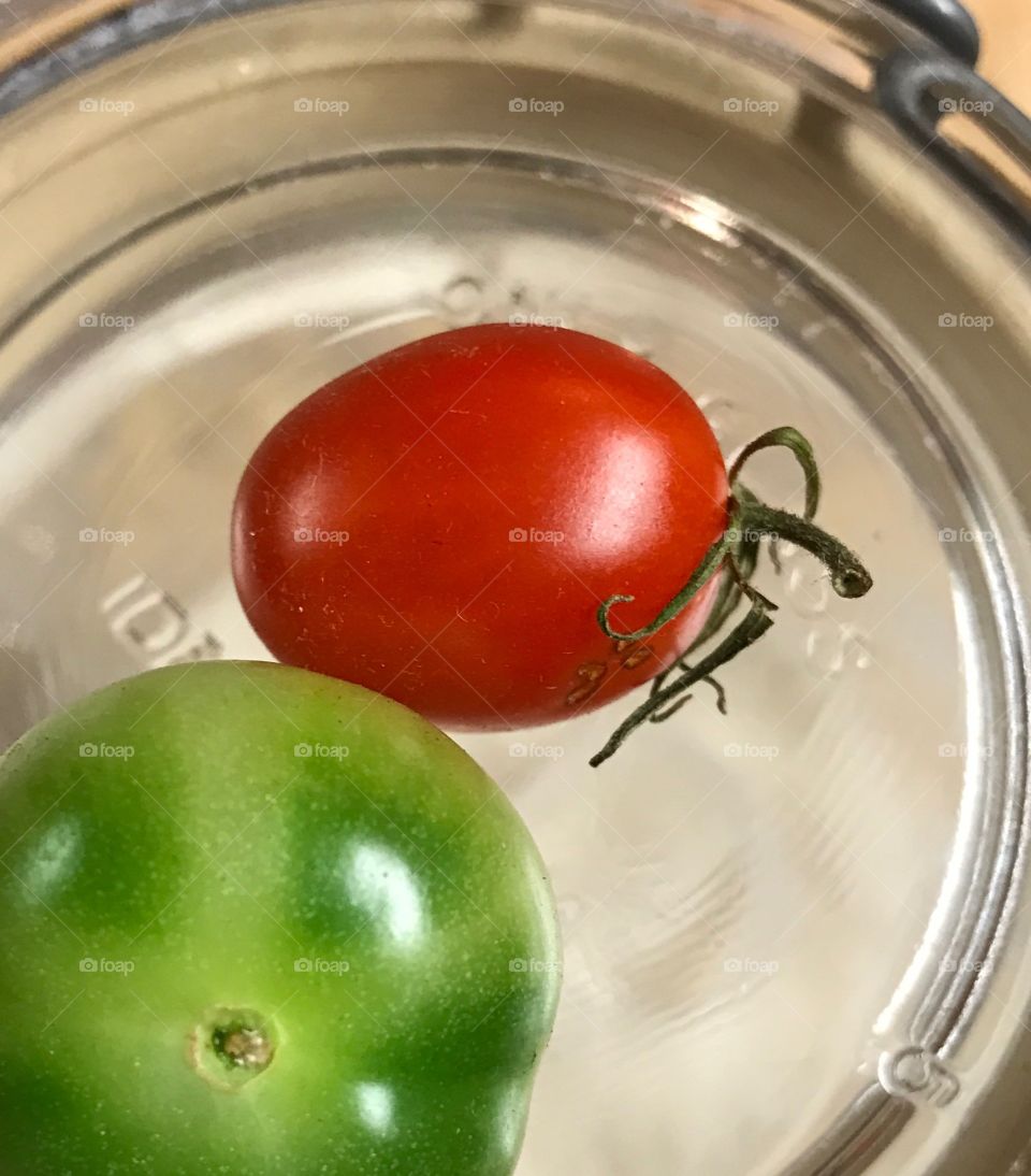 Tiny green and red tomato 