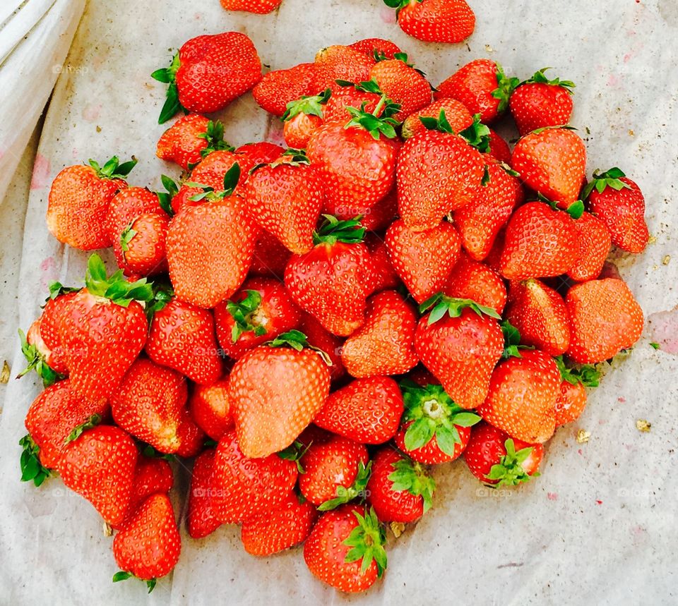 Many sweet strawberries being displayed at the streets of Weifang City China. 