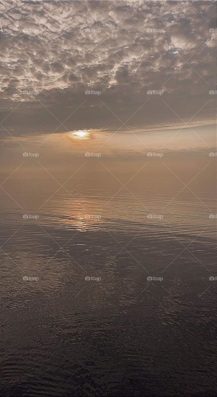 Early morning in weymouth sun shining on the sea