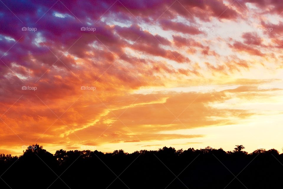 Scenic view of dramatic sky during sunset