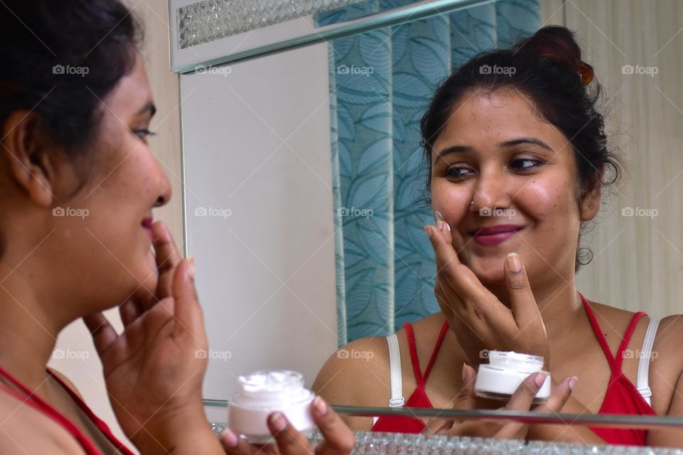 Woman applying cream