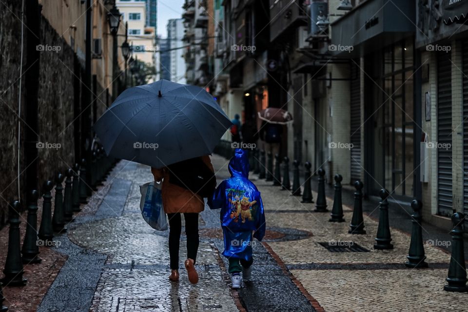 Mother and Child walking along the road after the school.