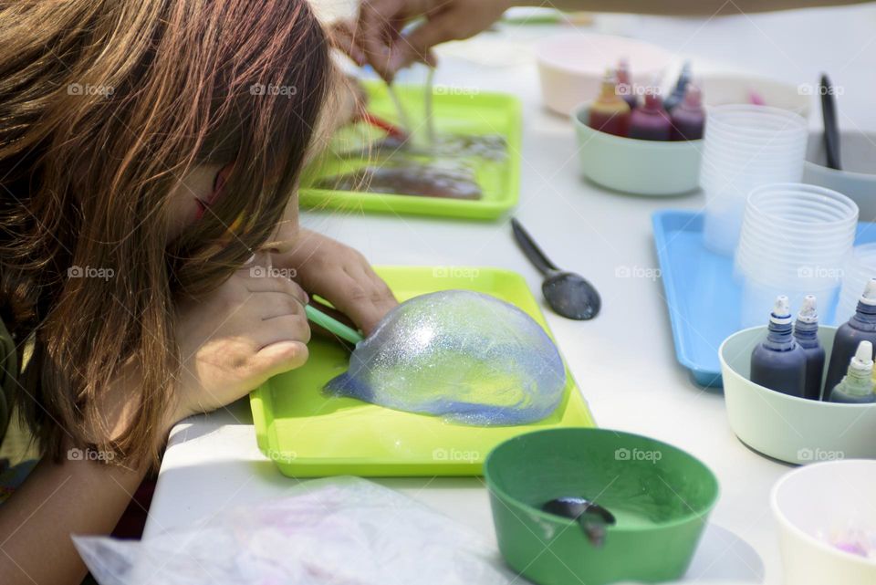 Making slime at a children's party.  Chemical experiments