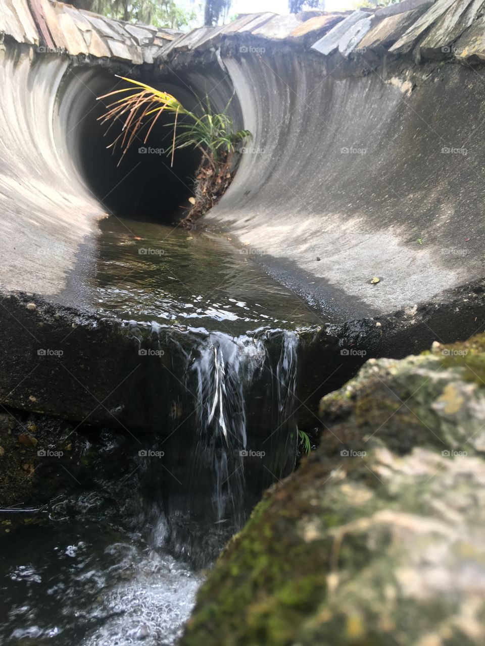 Water running through a pipe outside 
