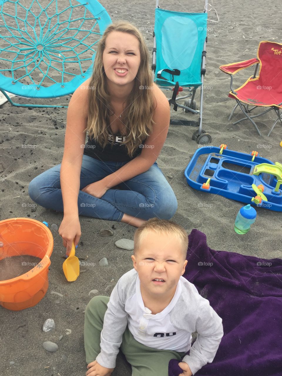 Mother and son enjoying on beach