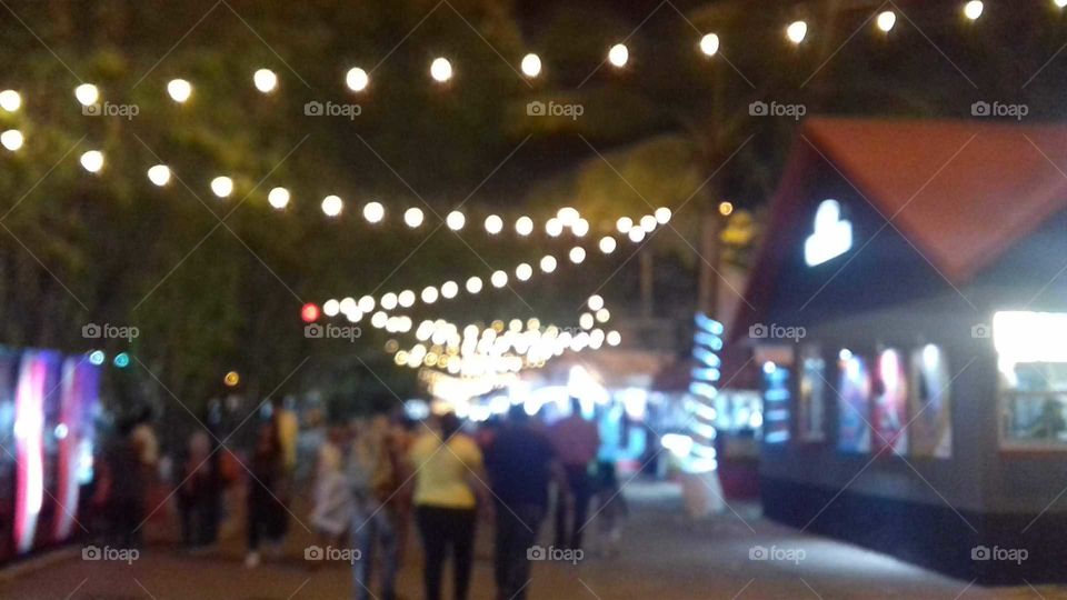 night fair illuminated with many spotlights