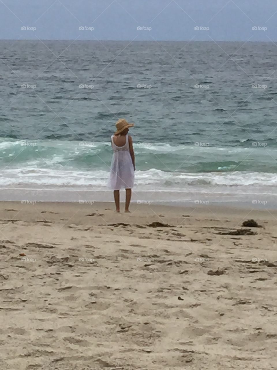 Woman by the ocean