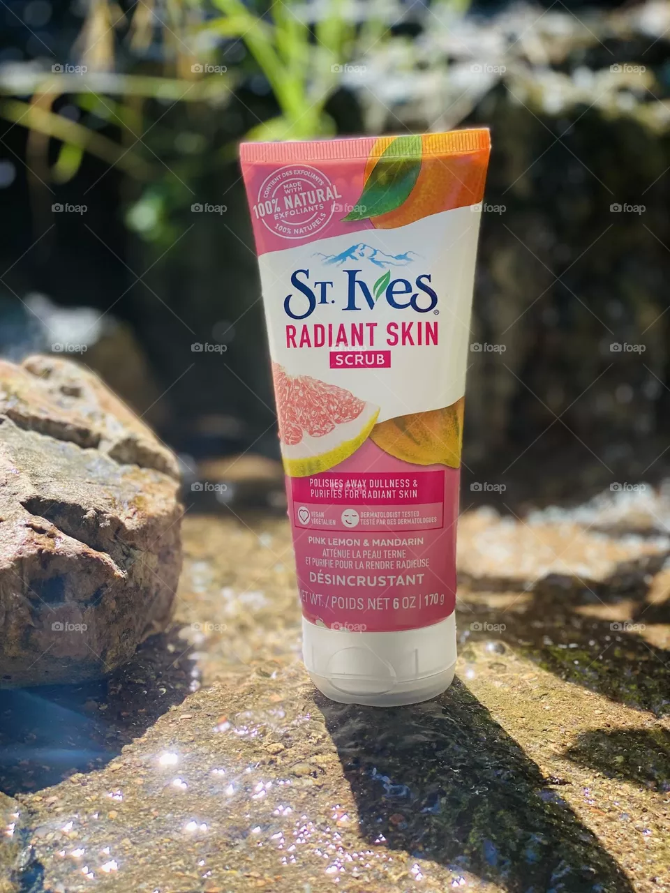 St. Ives Radiant Skin Scrub beauty product in water