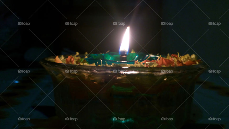 oil diya or oil lamp burning for the decoration looks attractive. with black background.