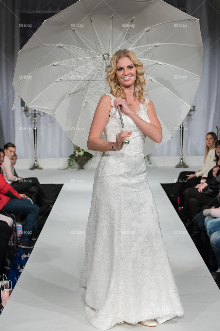 Fashion show at a wedding fair. Here are the latest dresses and clothes for both bride and groom.