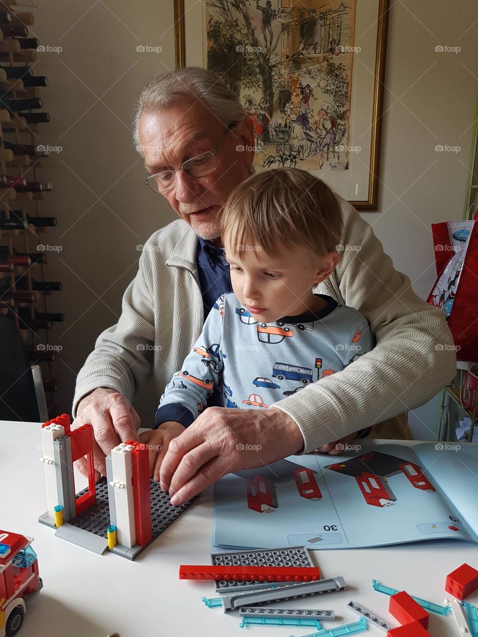 Grandfather and grandson with building blocks