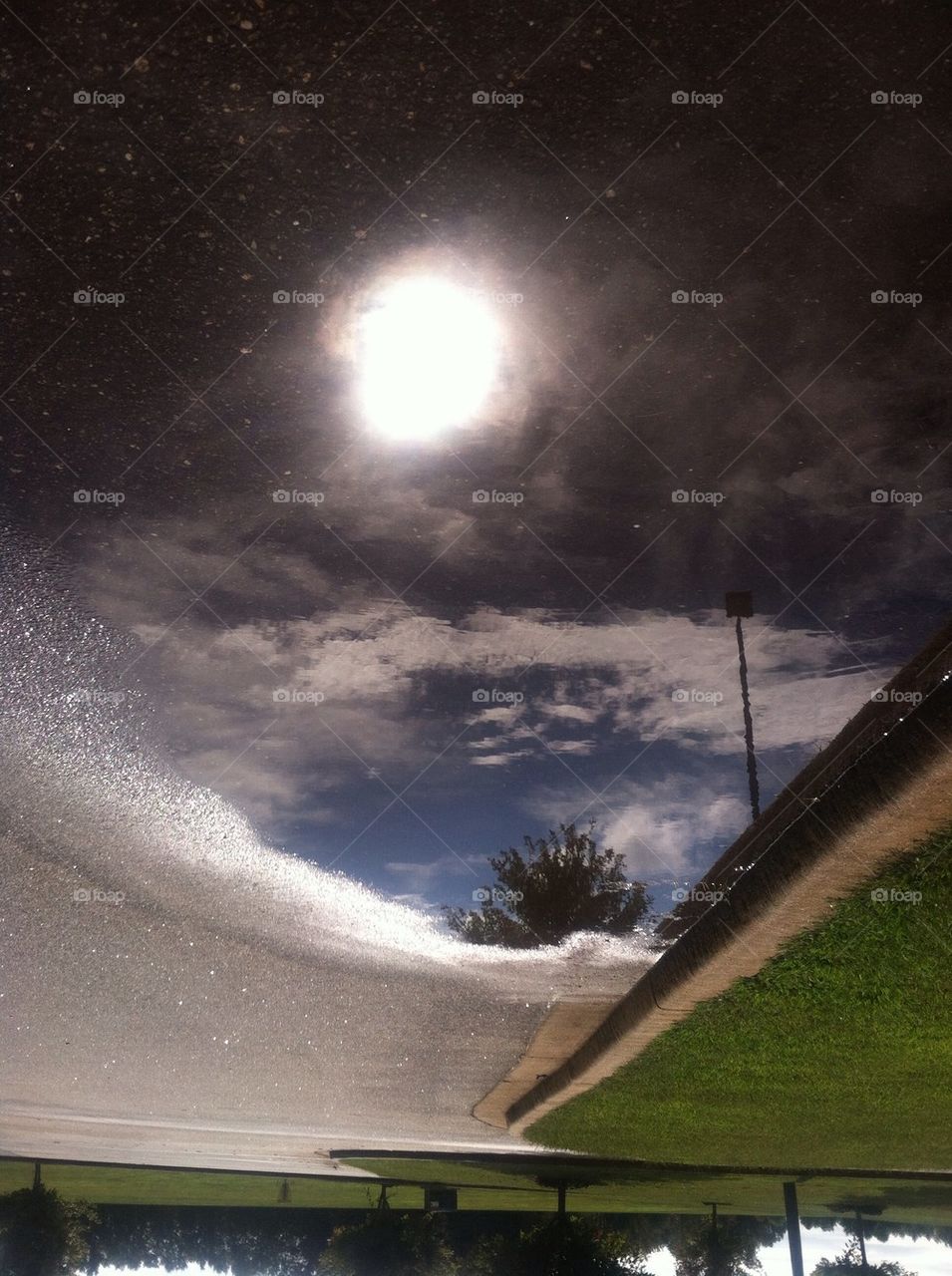 The sky from a water puddle