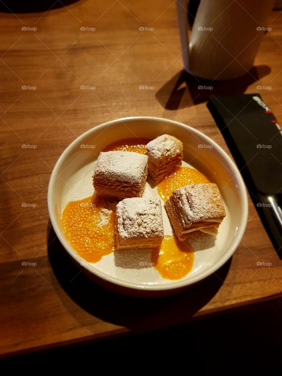 Cake in white plate at the table