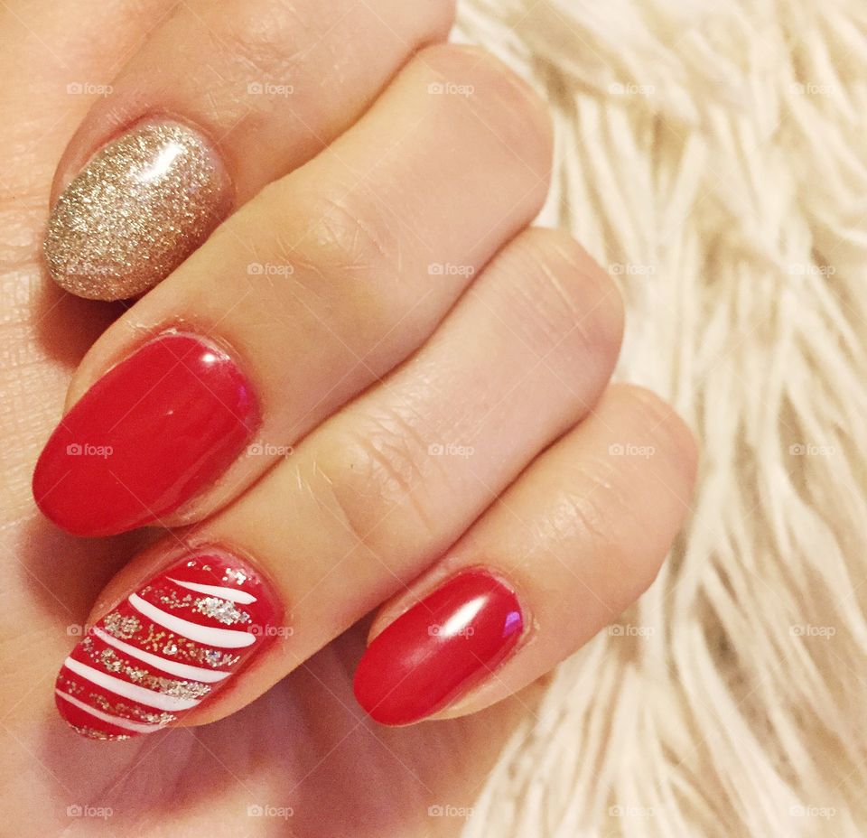 Festive nails for the holidays - red, gold, silver and candy cane stripes. 