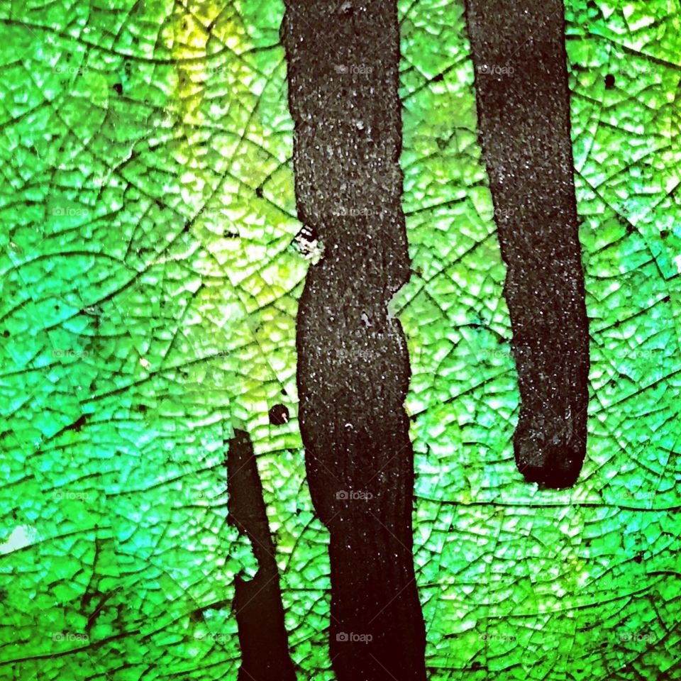 Close Up of Green Ceramic Black Drips