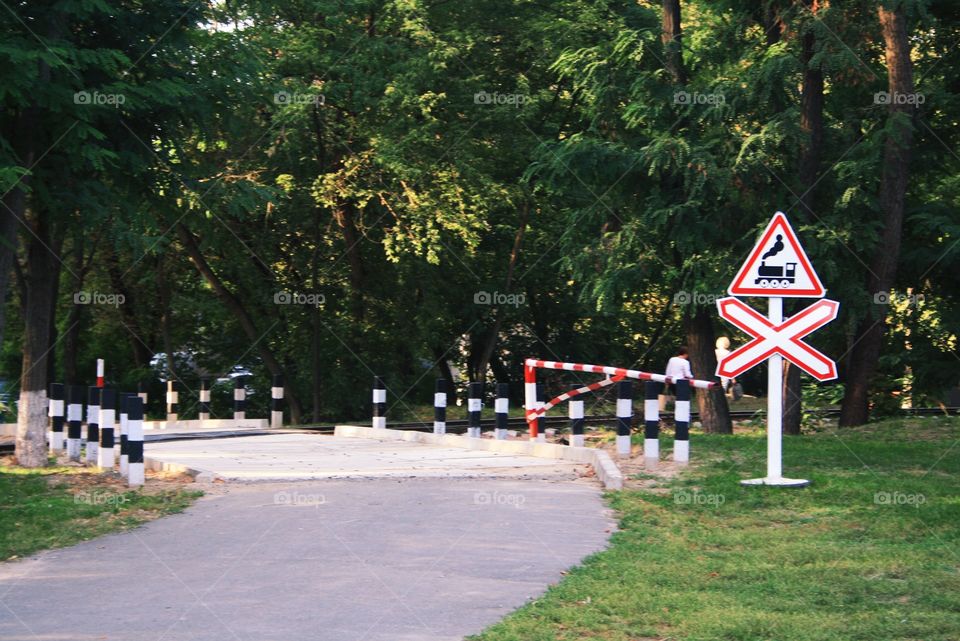 Railroad crossing. Railway for children in the park