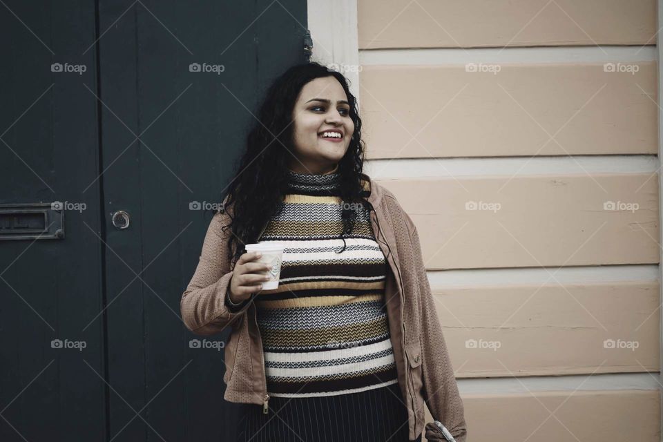 Happy Woman with a lovely smile as she starts her day to work 