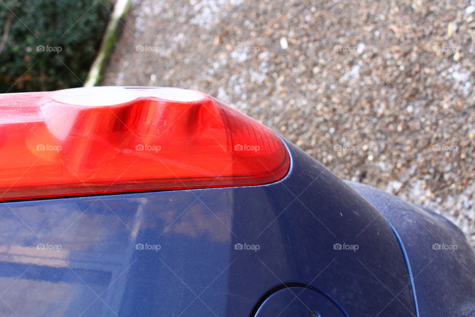 Close-up of blue car with red taillights