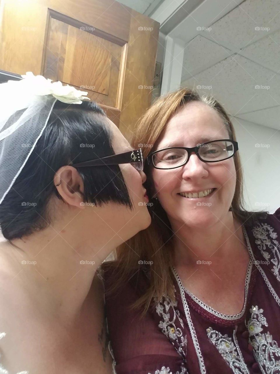 bride kissing mother