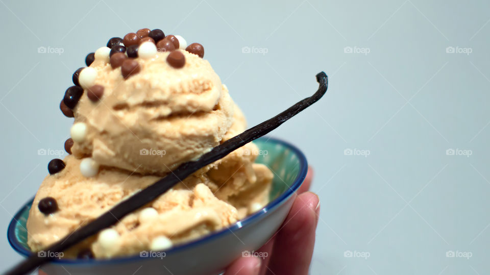 Close-up of hand holding ice cream