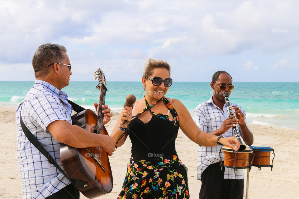 Trio ensemble performing on the beach, Cuba, Varadero