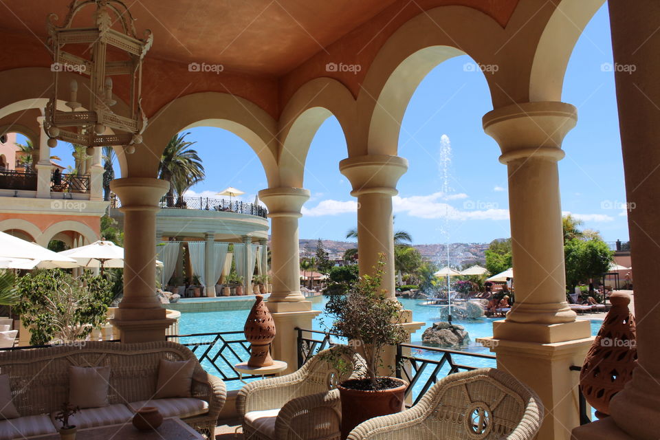 Tropical resort relaxation by the pool.