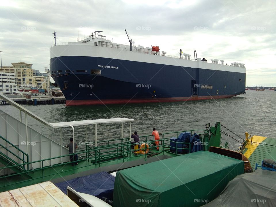 huge ship at labuan island, Deploying car from around the world. equal to 5 level building high