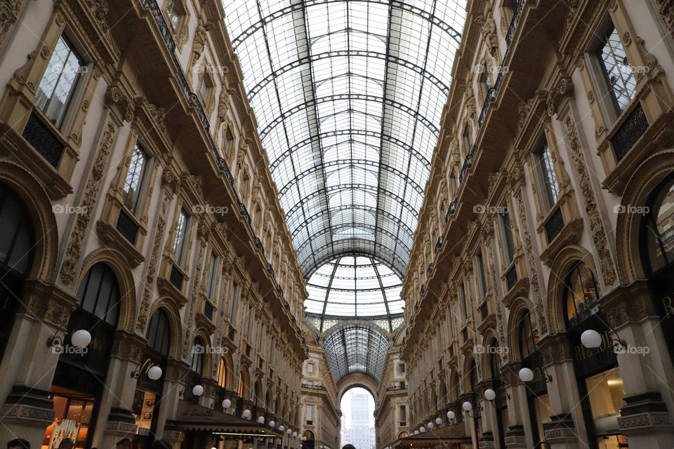 Under the glass roof connecting the old buildings 