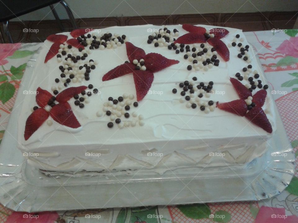 Decorated birthday cake with strawberries