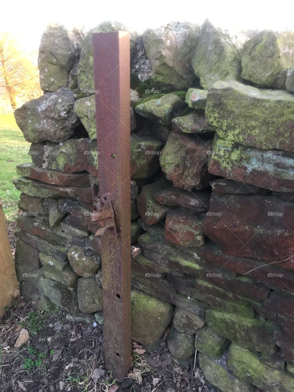 Old metal gate post
