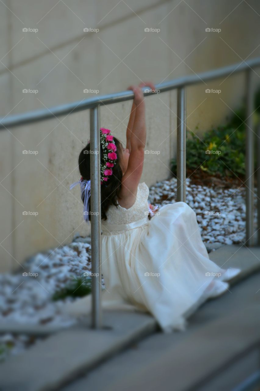 Flower Girl playing around between photographs