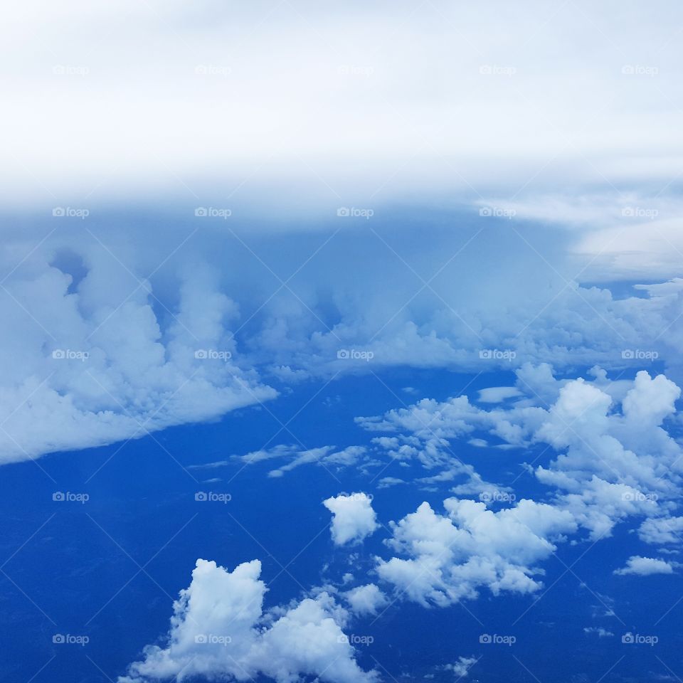clouds and blue sky viewed from airplane