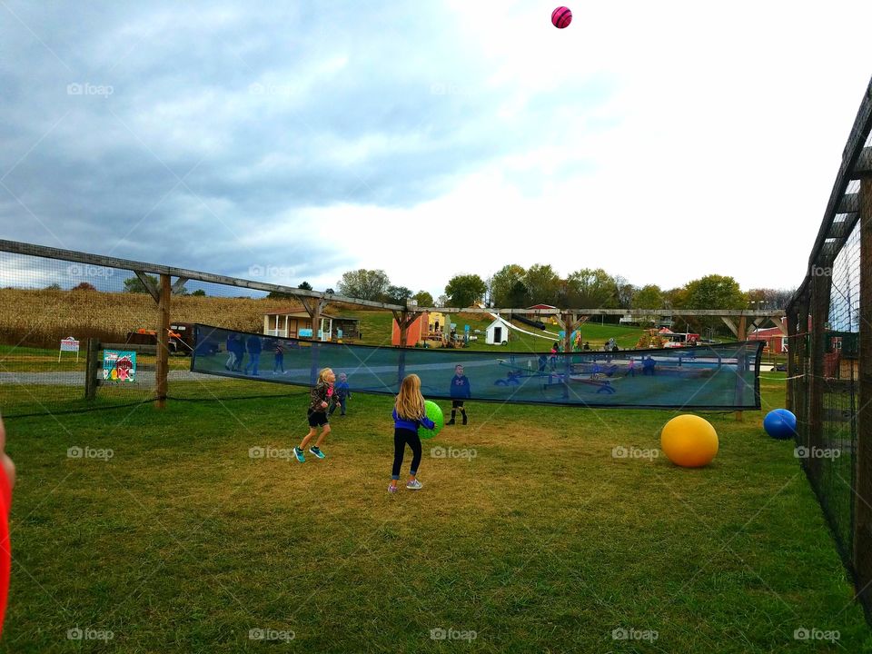 Playing giant volleyball at the fall festival