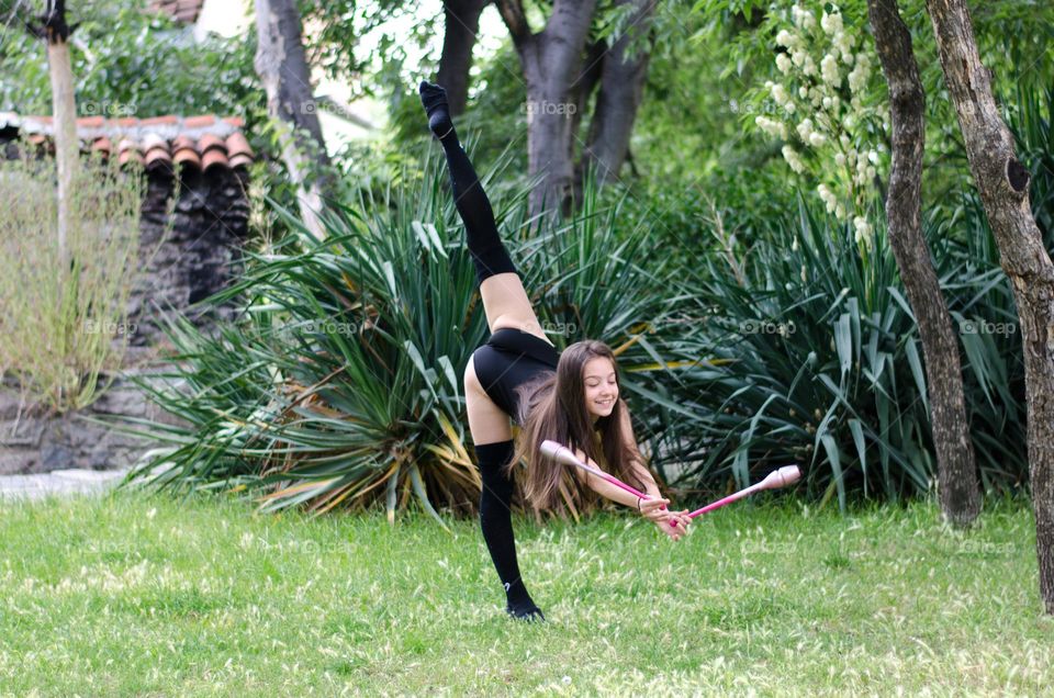 Beautiful Young Gimnast Dancing in Nature