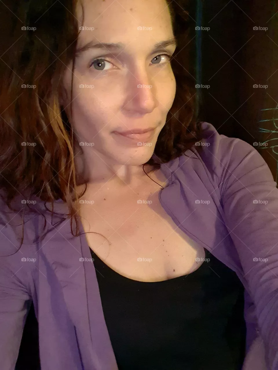 woman looks into the camera