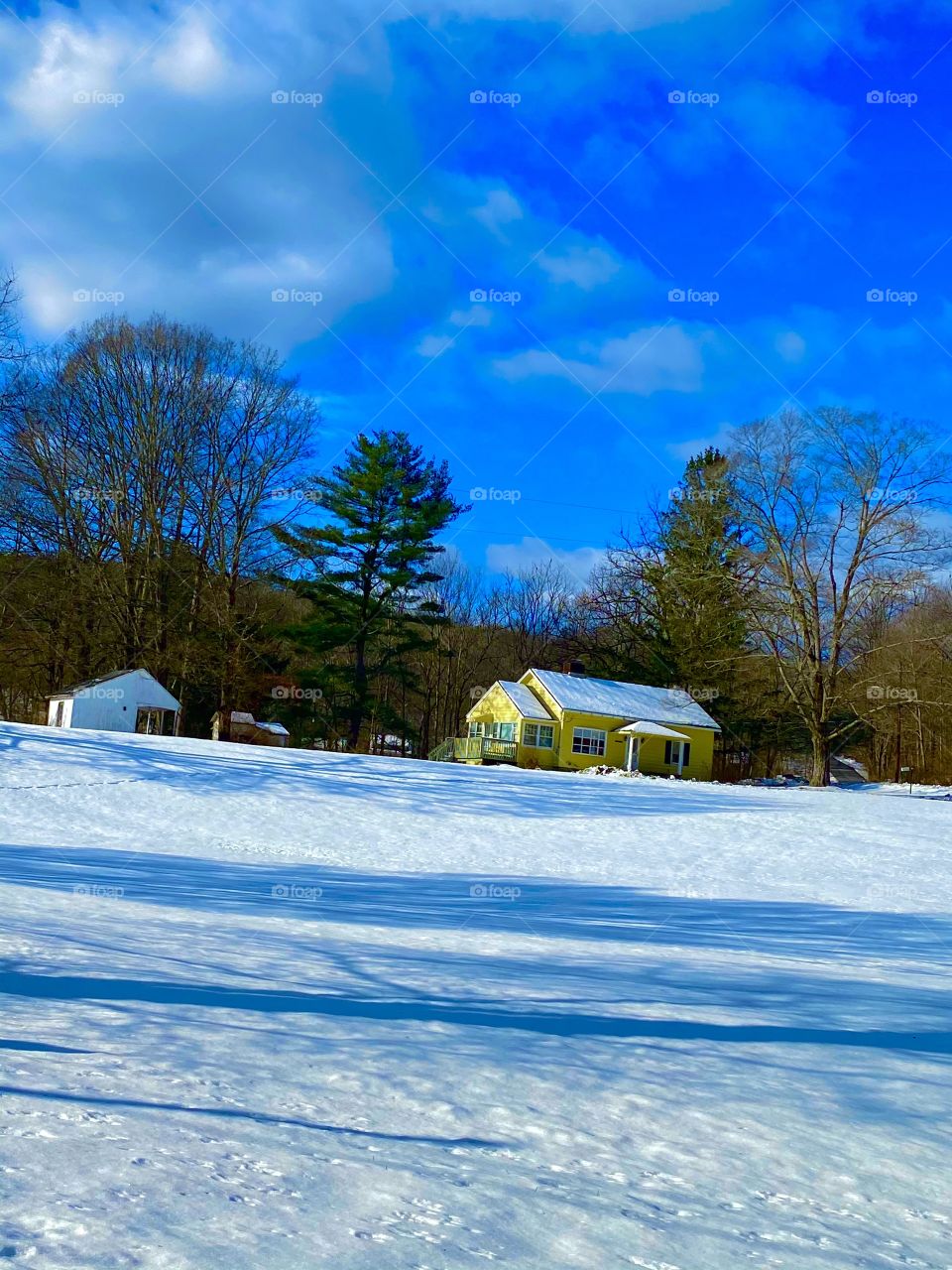 Little yellow house in the winter 