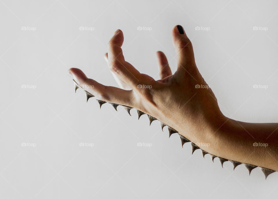 Human hand with spikes on it