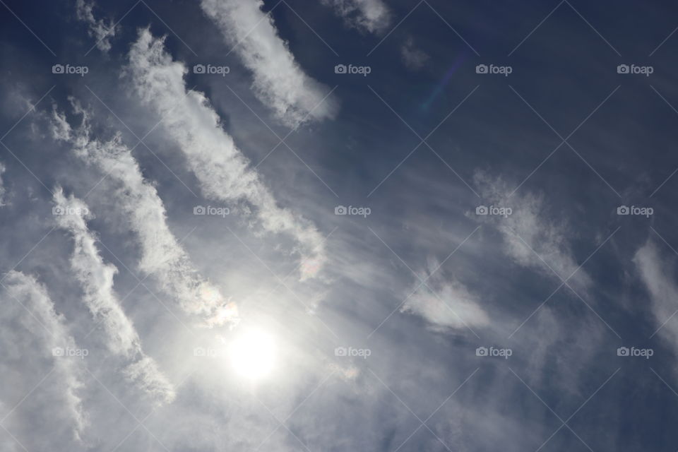 Clouds in the sky featuring the sun 