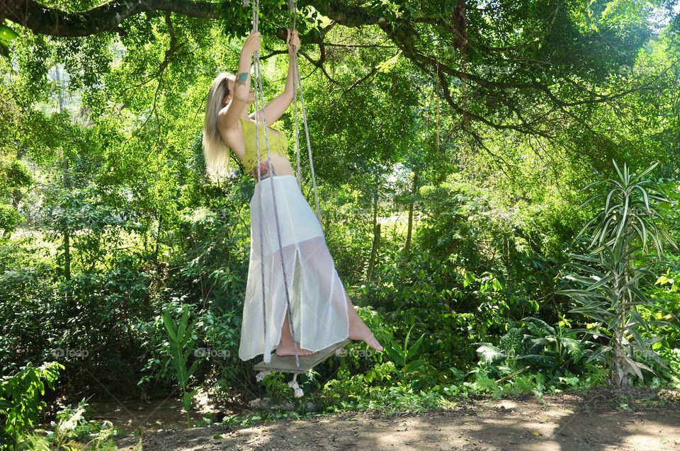 a woman on a swing