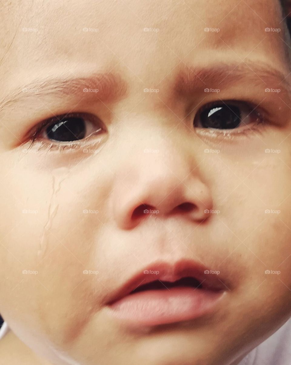 toddler with a sad face