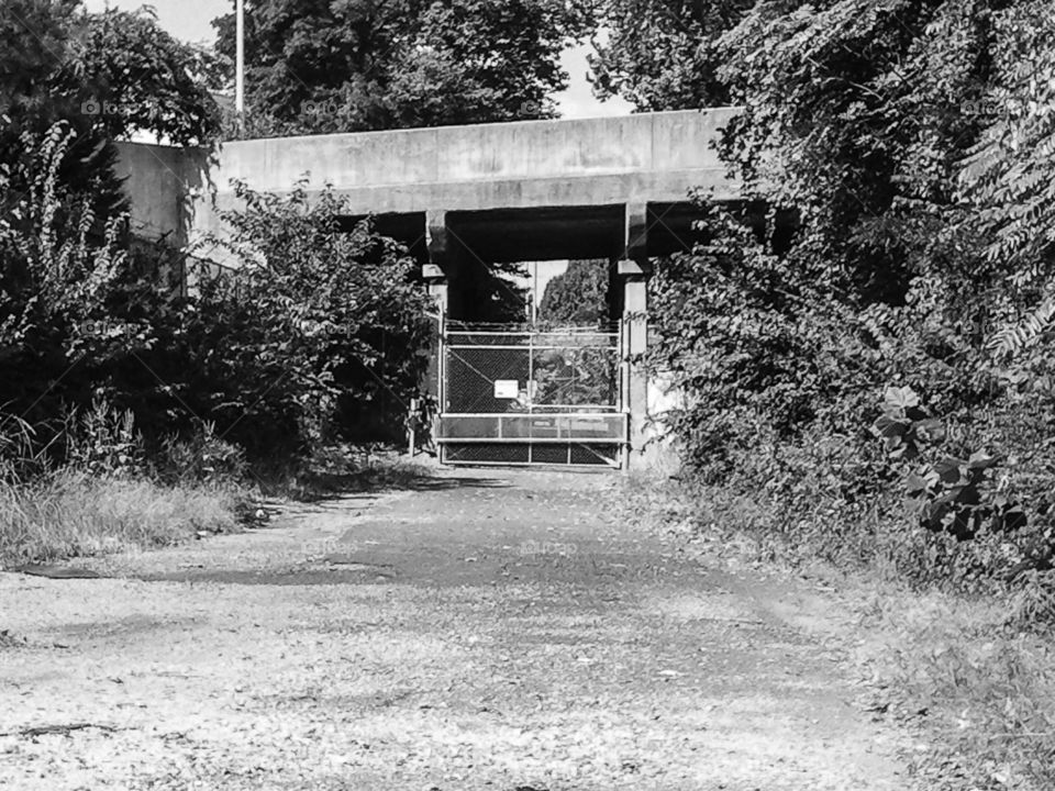 Abandoned Mystery. A closed of and abandoned path under a bridge.
