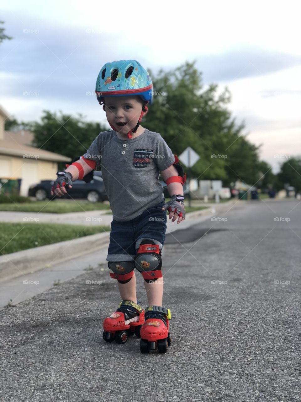 Happy toddler learning to skate