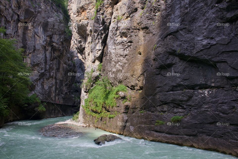 Rock formation and water flowing at aare canyon