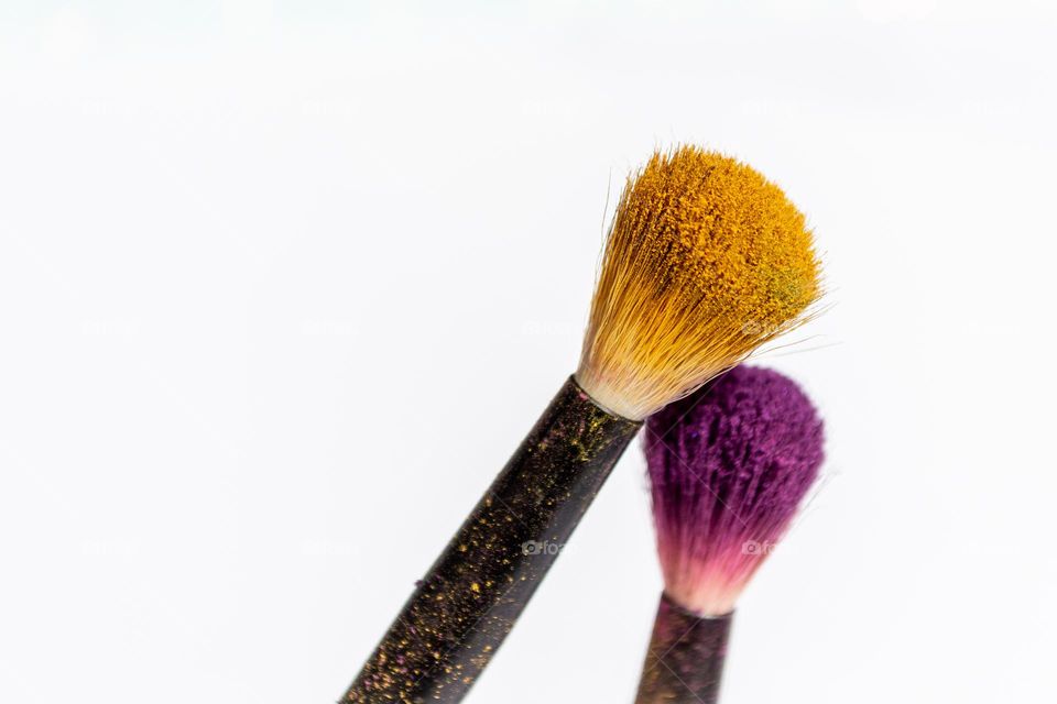 Complementary colors always give something extra. Yellow eye shadow and purple eye shadow on brushes. Lots of dust, but lots of color, too.