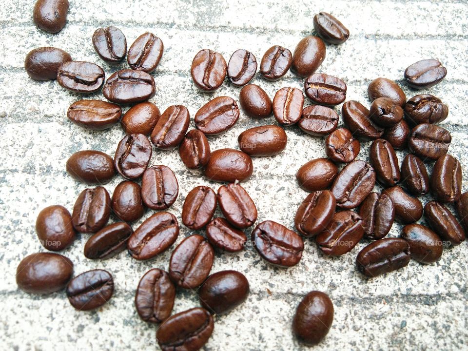 coffee beans on concrete floor